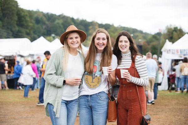 a couple enjoying food at the Apple Festival